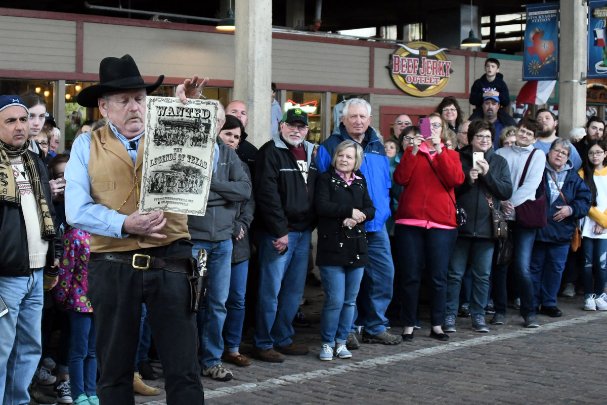 039 Fun Club and other travelers gather at Stockyards Station for the shootout.JPG